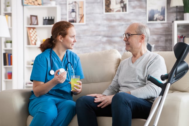 senior-man-in-nursing-home-smiling-to-the-nurse-2021-08-27-15-11-04-utc